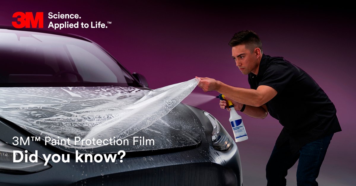 Technician installing 3M Paint Protection Film (PPF) on a car hood at Samrat Auto 3M-authorized center in Dubai